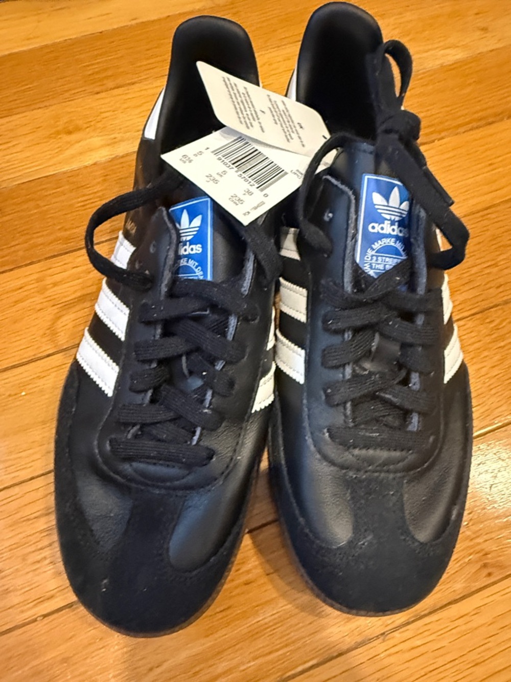 adidas Women’s Black and White Sneakers with Blue Logo